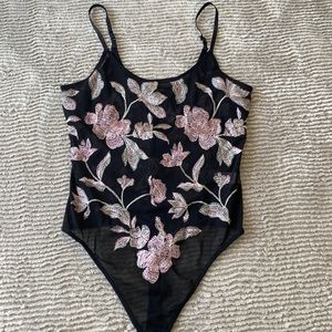 Sheer floral delicate body suit - it’s very beautiful.